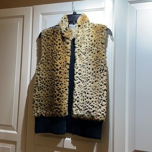 Faux Fur vest Size L. Back, sweater knit. Zip up front, lined.Well taken care of